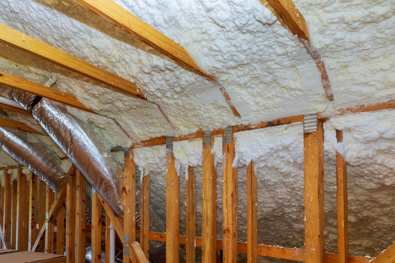 New home construction with installation of termal insulation installing at the attic